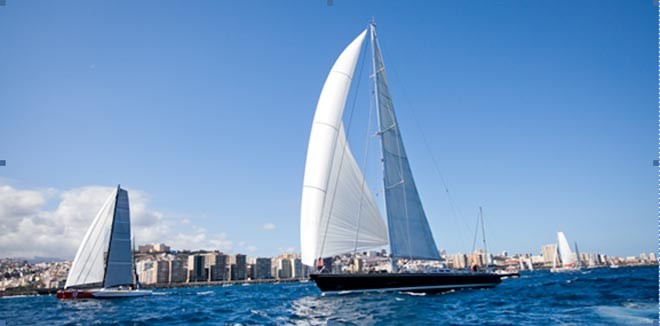 Rayon Vert and Oceans Seven2 cross the ARC2011 start line in Las Palmas © World Cruising Club. Photo James Mitchell  ©  SW